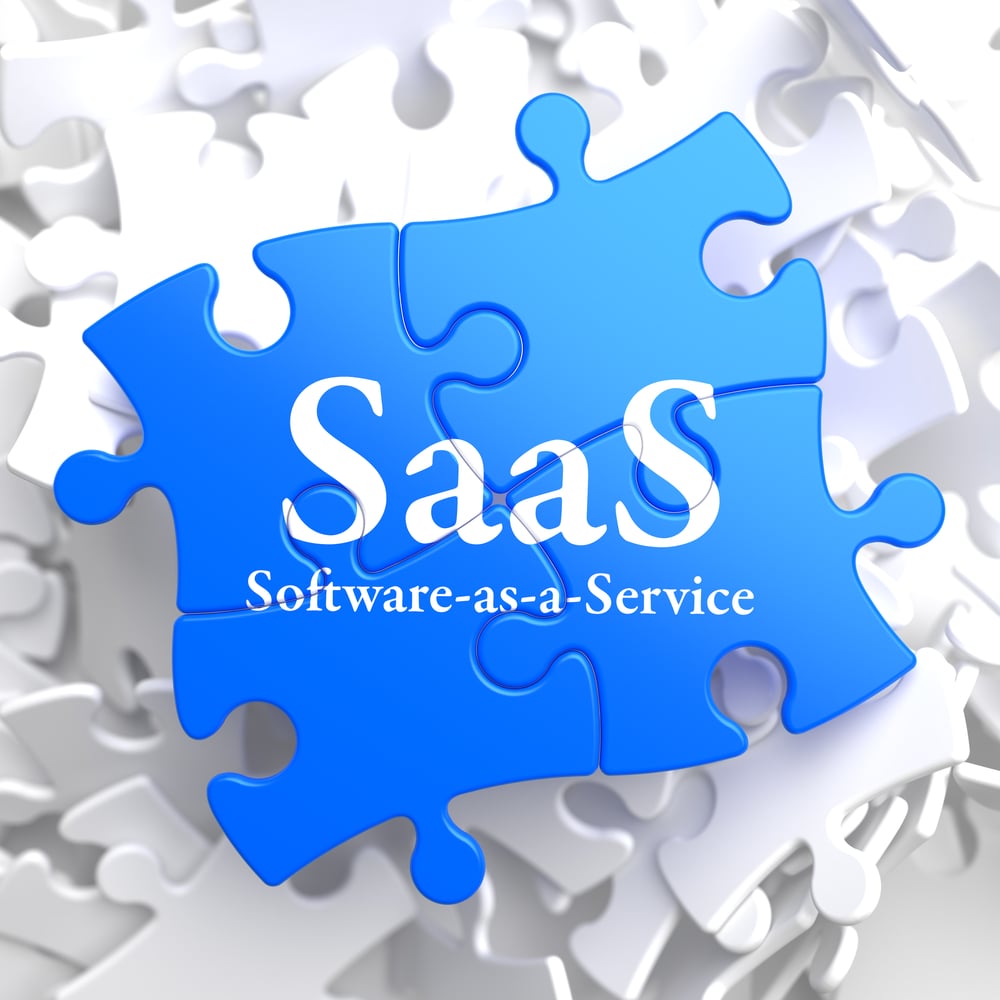 SAAS - Software-as-a-Service - Written on Blue Puzzle Pieces. Information Technology Concept. 3D Render.-1